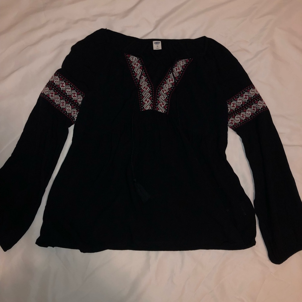 Black blouse with red and white detail